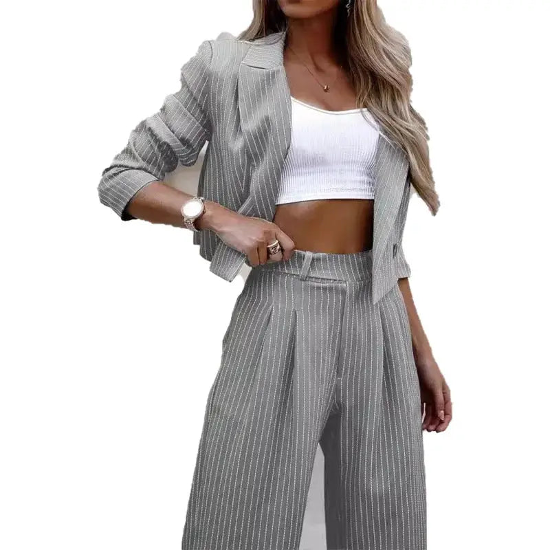 Women's gray pinstripe short-lapel blazer and straight-leg pants two-piece suit.