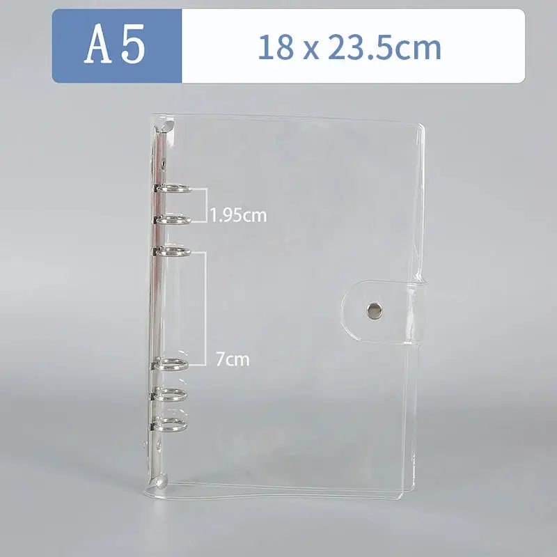 Transparent plastic A5 binder by Simples Market with six rings and snap closure.