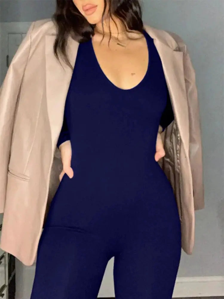 Jumpsuit outfit, 2-piece: navy blue jumpsuit with scoop neckline and beige blazer