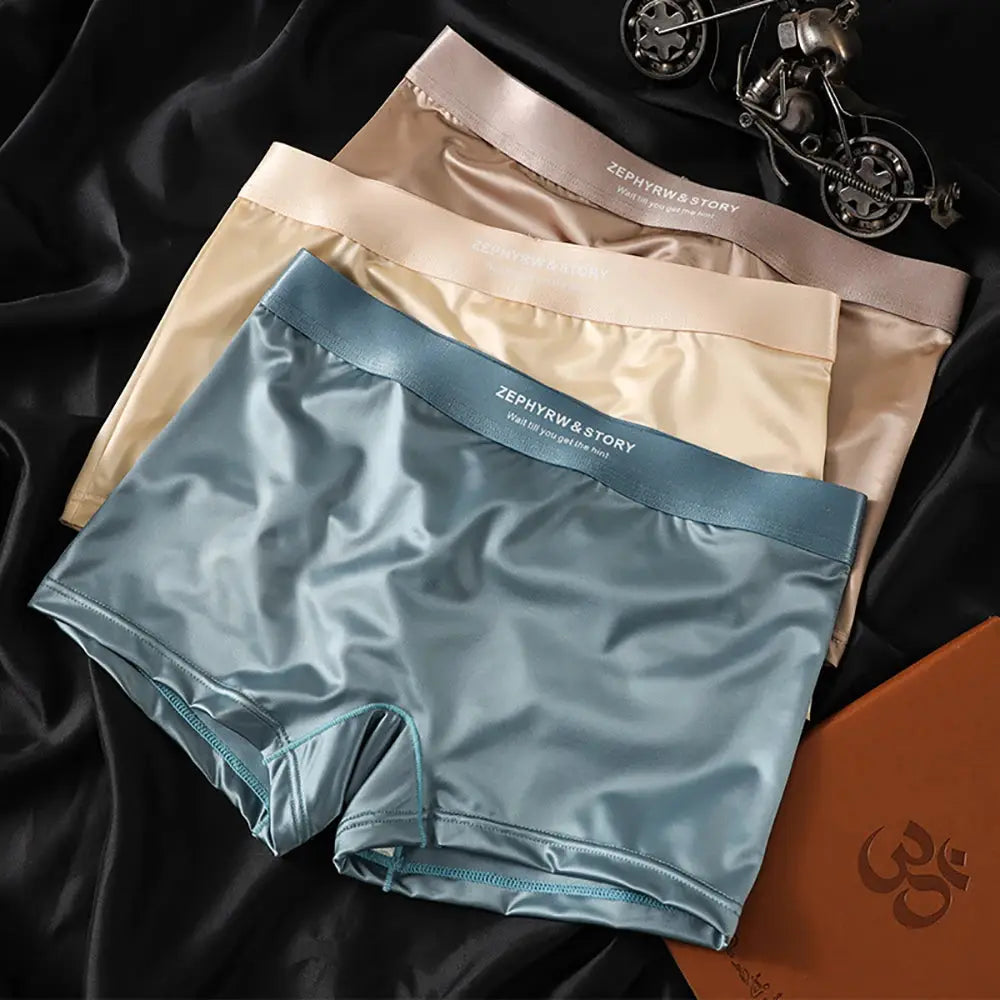 3-pack ice-silk satin panties for women in blue, beige, and peach with 3D double-layer breathable mesh crotch.