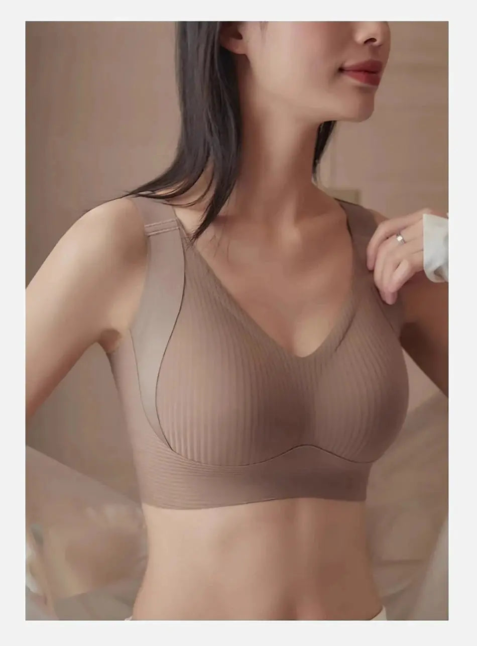 Seamless wireless bra in nude beige with ribbed fabric and wide straps.
