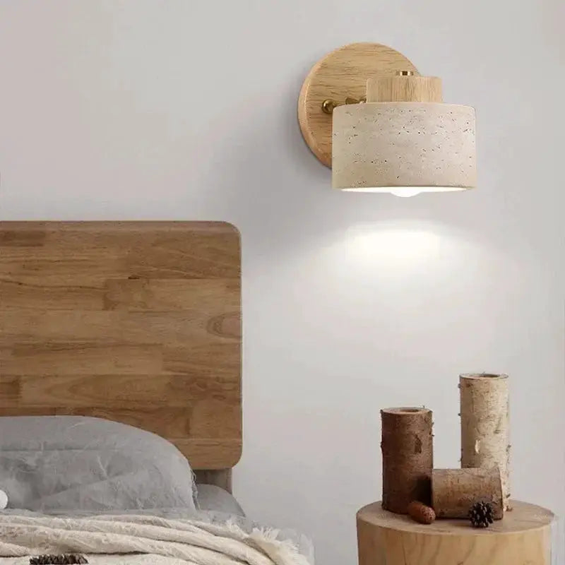 Bedside wall lamp with yellow cave-stone shade and wooden backplate; rotatable with switch.