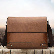 Brown textured leather men's shoulder bag with front flap and adjustable crossbody strap