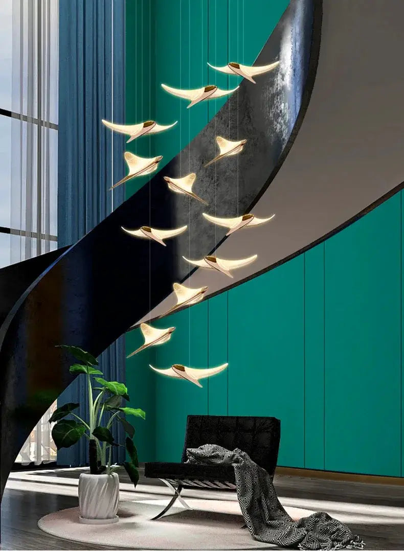 Seagull staircase pendant lamp by Simples Market; modern long multi-pendant lighting with gold-toned seagull shapes.