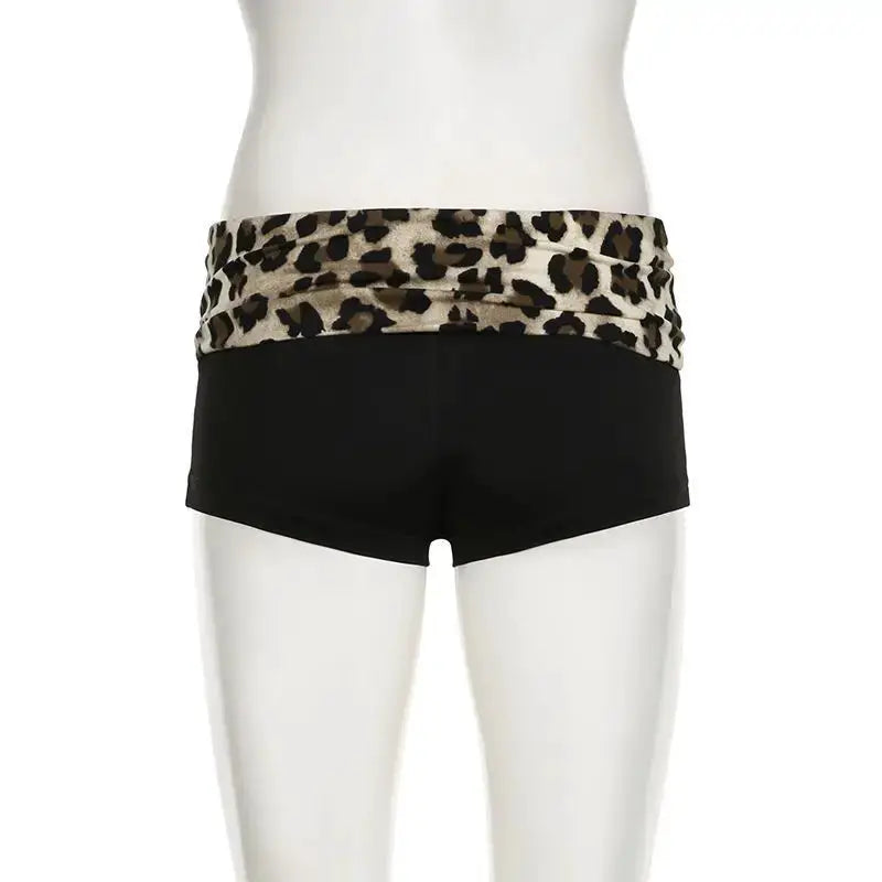 Leopard patchwork booty shorts by Simples Market, black low-rise with leopard-print waistband for women