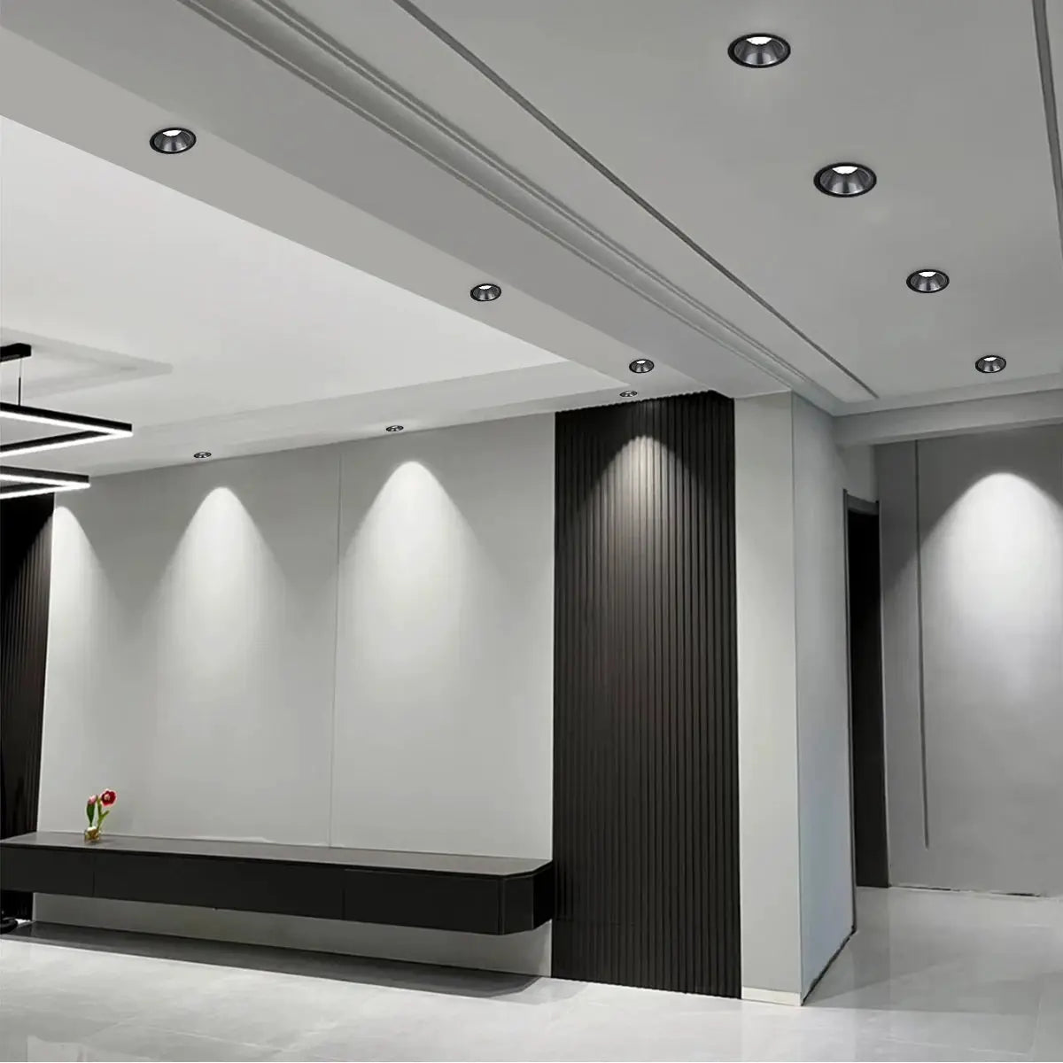 Simples Market recessed aluminum COB LED spotlights in a modern white ceiling with a black panel wall