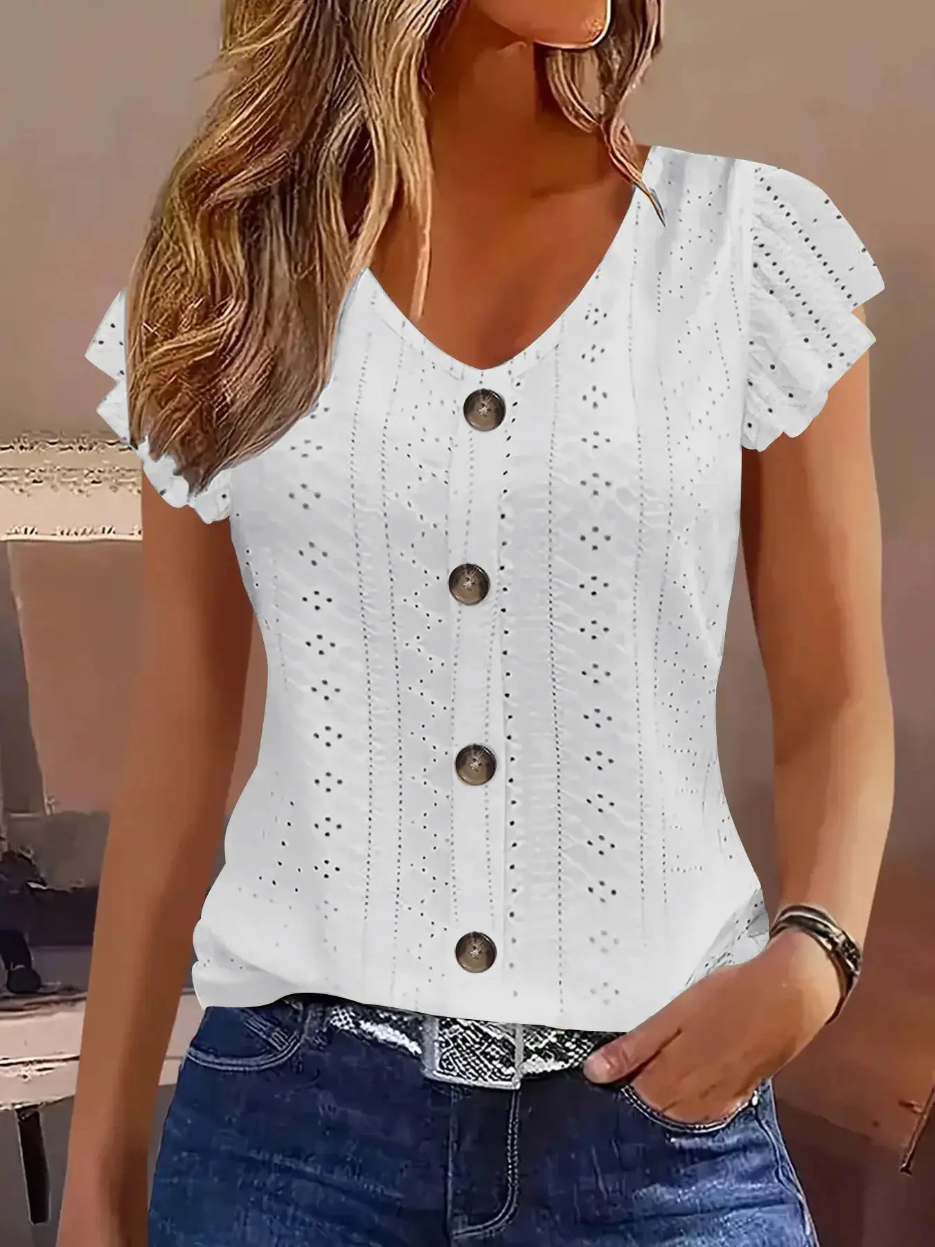 White eyelet V-neck blouse with short flutter sleeves and button-down front