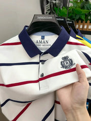 Men's short-sleeve striped polo shirt with navy collar, white body and red/navy stripes, crest embroidery