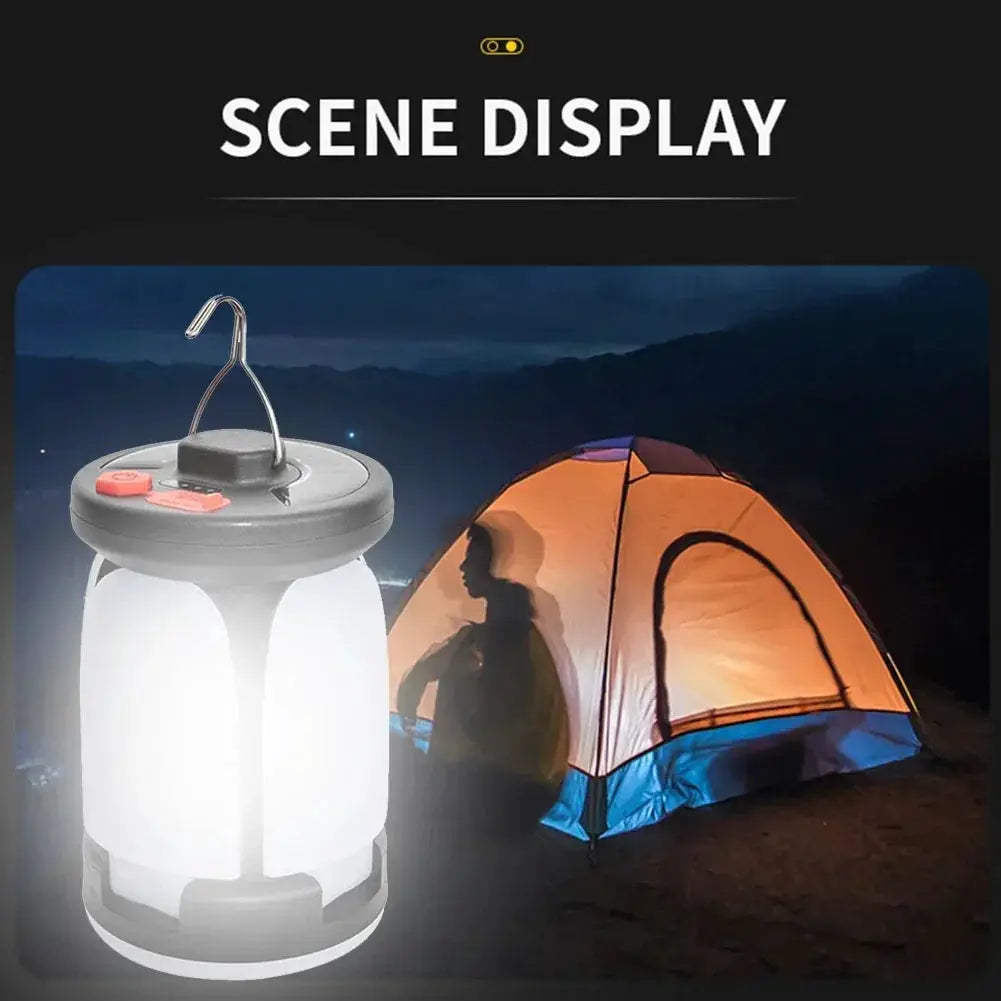 Simples Market LED camping lantern with hanging hook, solar USB rechargeable, glowing beside a camping tent