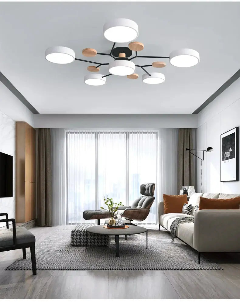 Modern LED chandelier with white circular shades and wood accents for living room