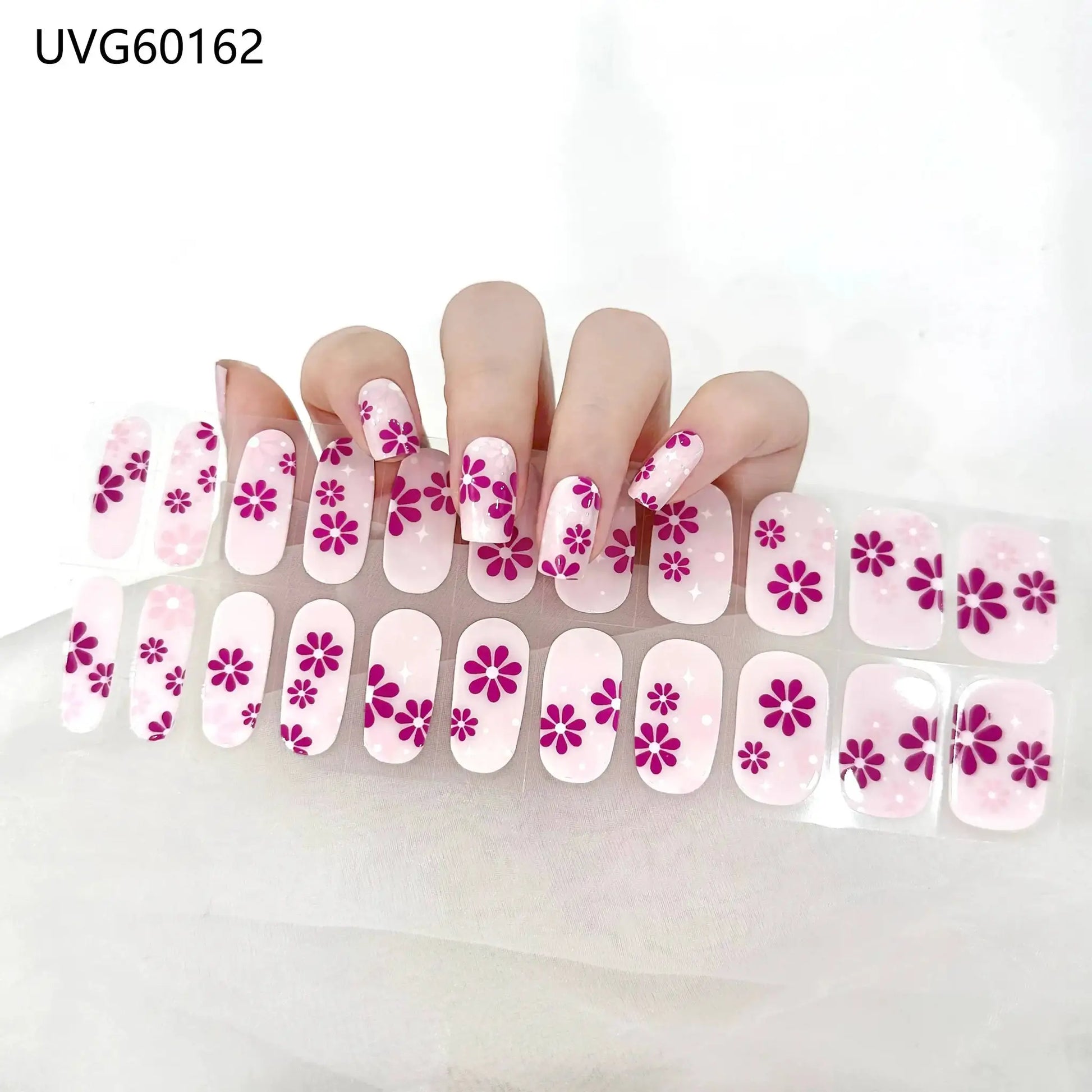 Gel nail wrap set in pink with purple floral design; full-cover, 16/20/22 tips, UV lamp-ready