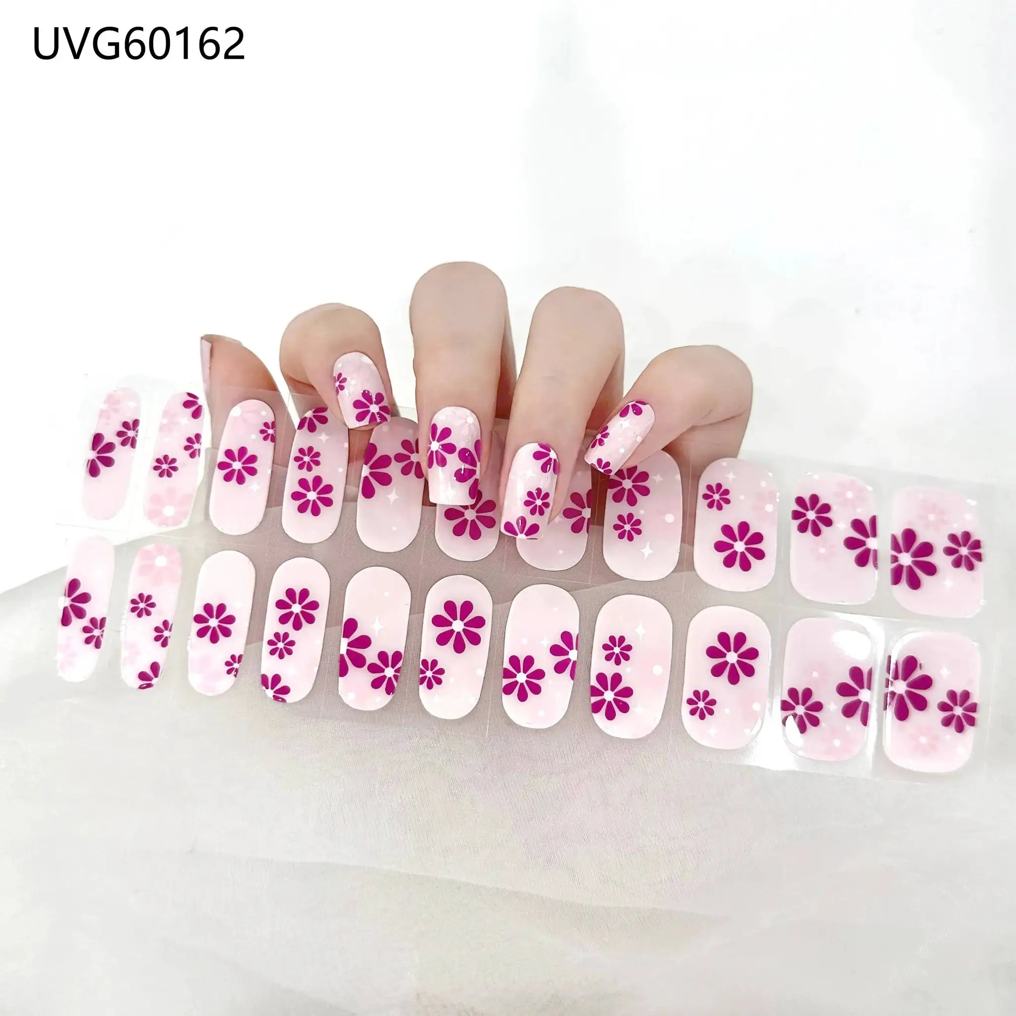 Gel nail wrap set in pink with purple floral design; full-cover, 16/20/22 tips, UV lamp-ready