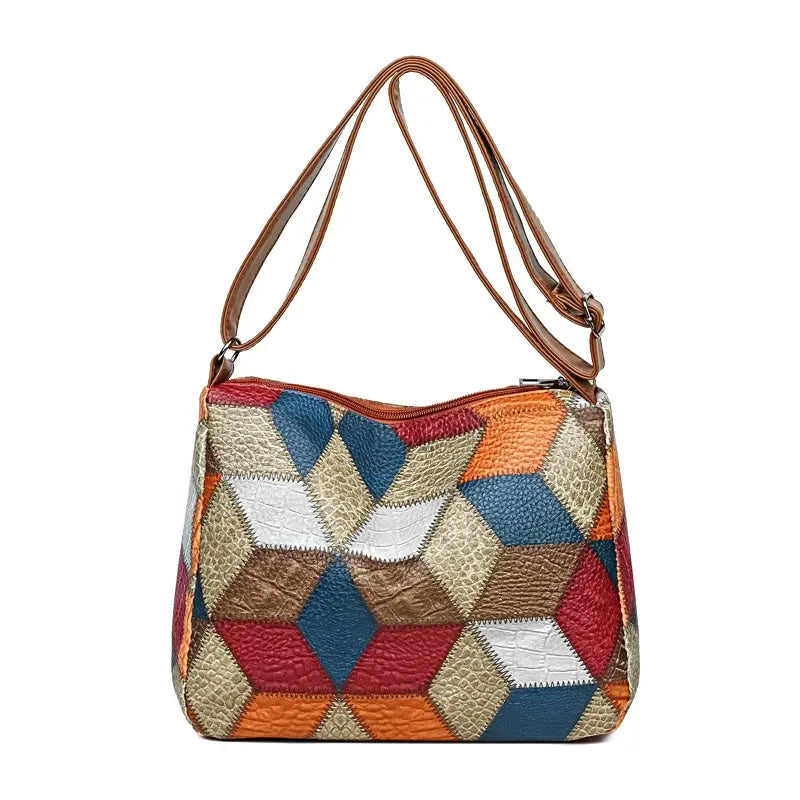 Women's crossbody bag with multicolor geometric patchwork and brown leather strap
