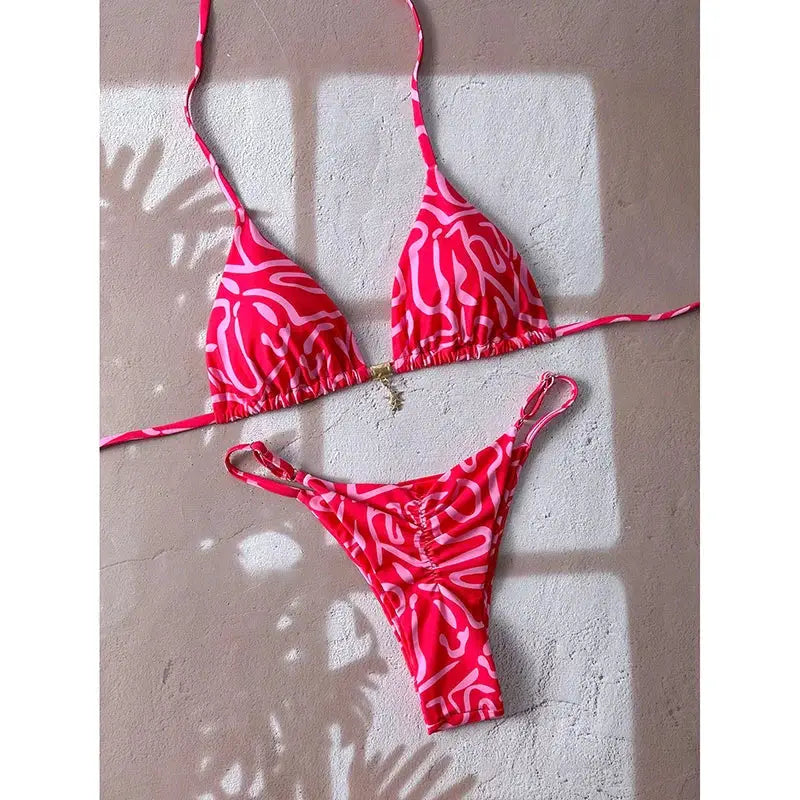 Simples Market two-piece bikini set in pink and white abstract pattern with string-tie triangle top and thong-style bottom