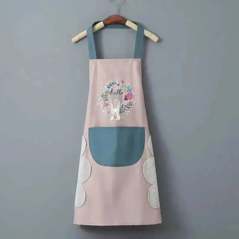 Women's pink kitchen apron with teal straps and front pocket, oil-proof waterproof, floral print.