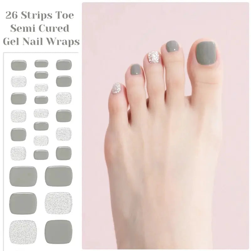 Gel nail strips by Simples Market Gradient Auroras; 26 semi-cured toe wraps in gray and glitter finishes.