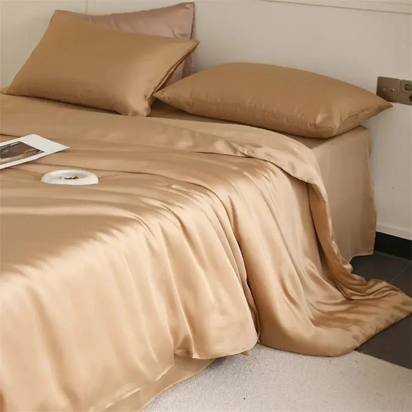 Simples Market Mulberry Silk Bedding Set in champagne beige; includes duvet cover, sheets and pillowcases.