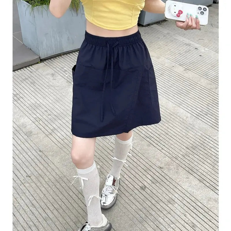 Navy blue high-waist A-line mini skirt with drawstring waistband and side pockets
