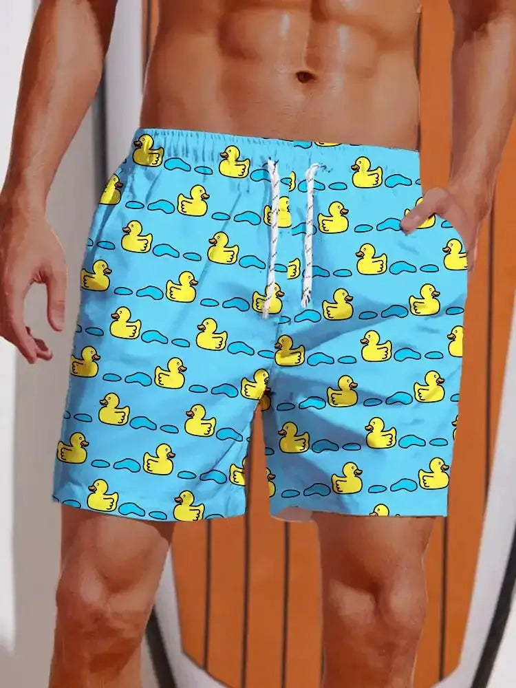Men's swim shorts, blue with yellow duck print, elastic waist with white drawstring.