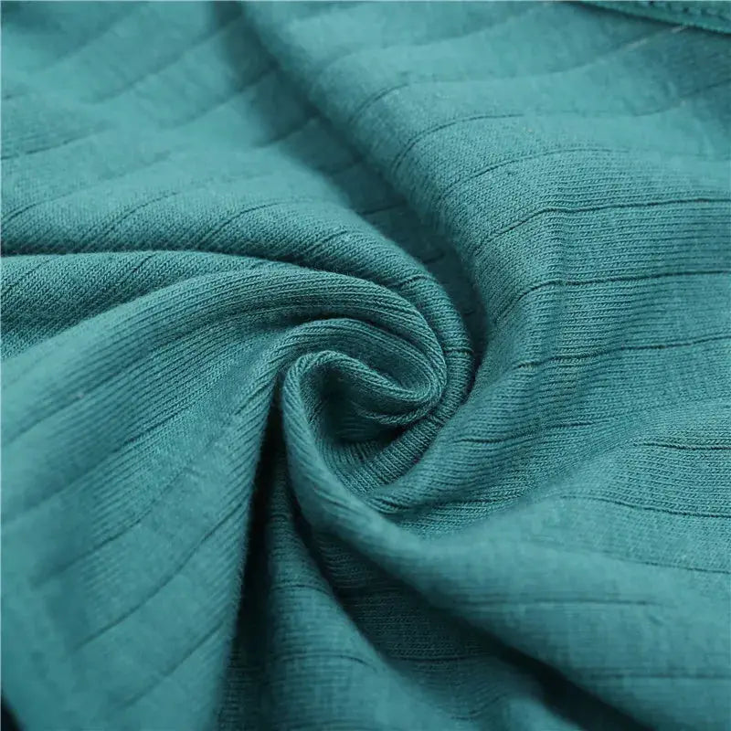 Women's teal striped cotton briefs close-up of ribbed knit fabric