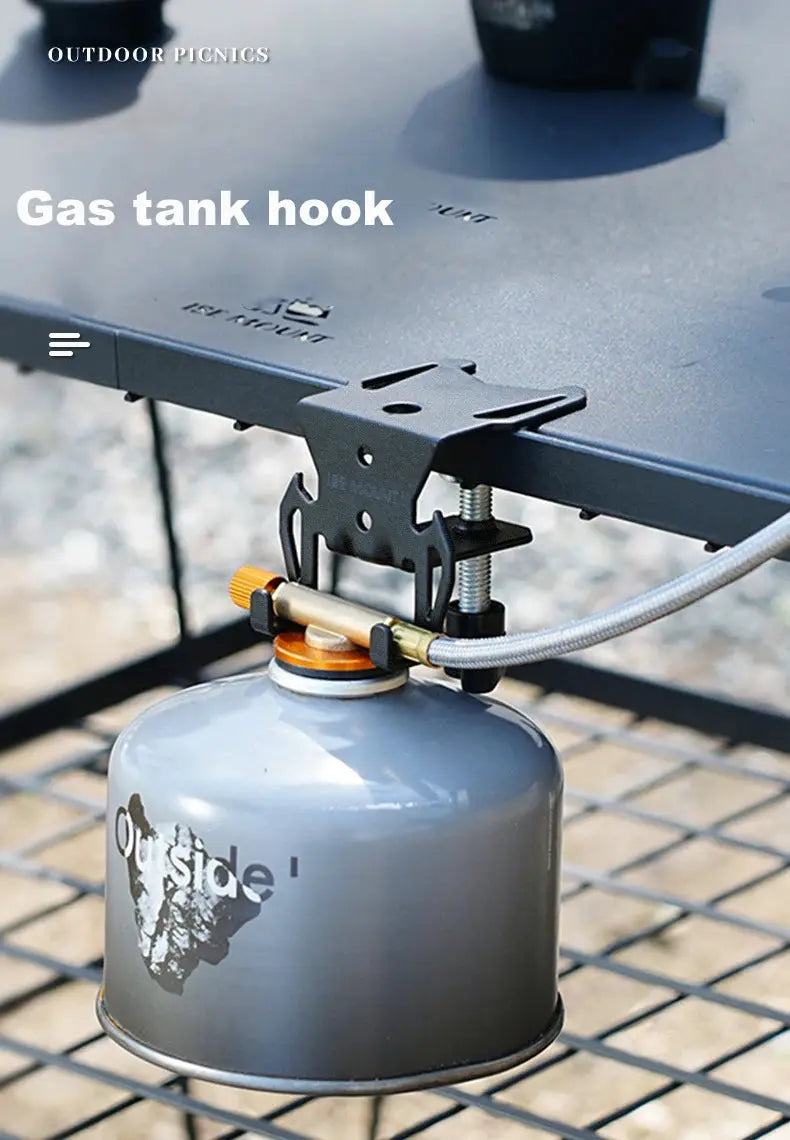 Gas tank hook with hanging plate for camping stoves; gray canister secured under a metal tabletop.