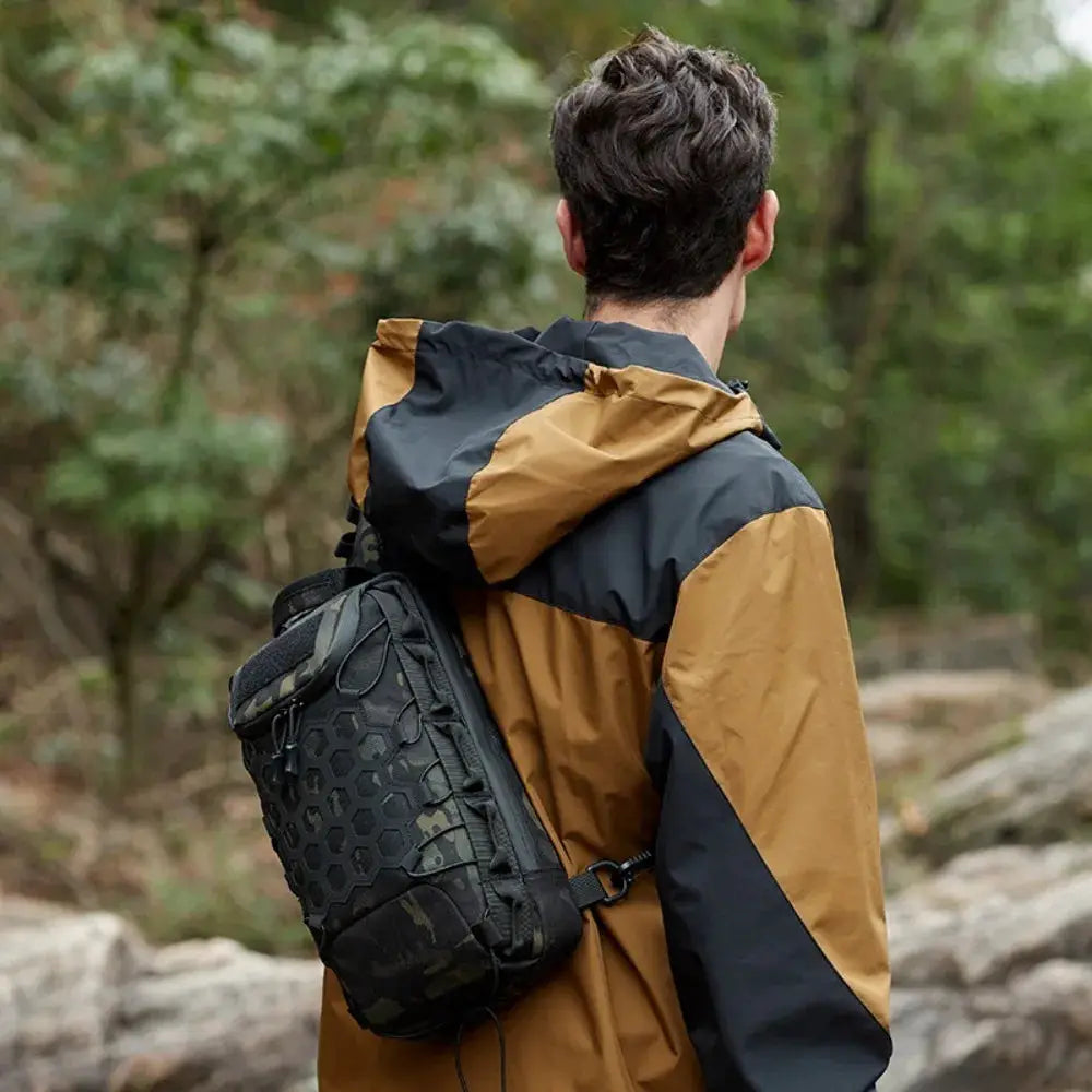 Simples Market Outdoor Port Bag Pack Tactical Sling Backpack with black hex-pattern exterior.