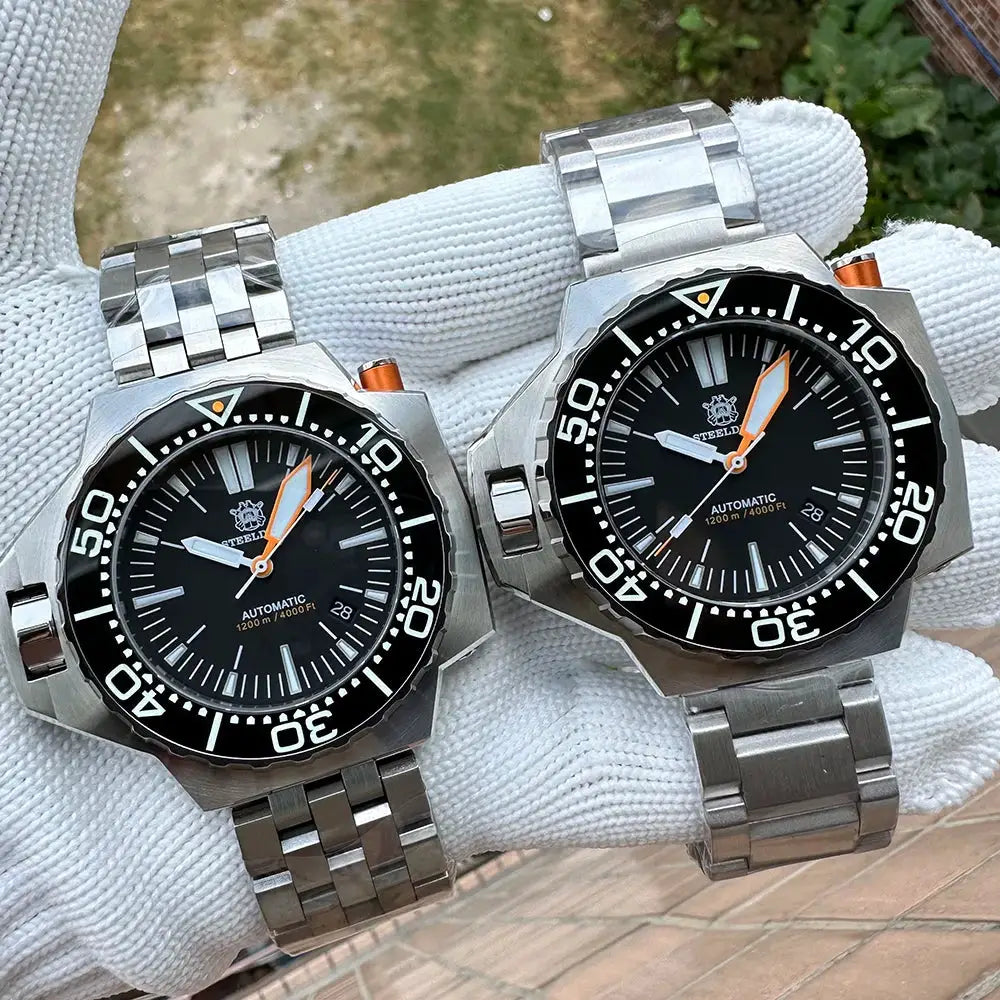 Steeldive Proplof SD1969 V3 dive watches pair; black dial, orange hands, steel bracelet; 56mm, 1200m water resistant.