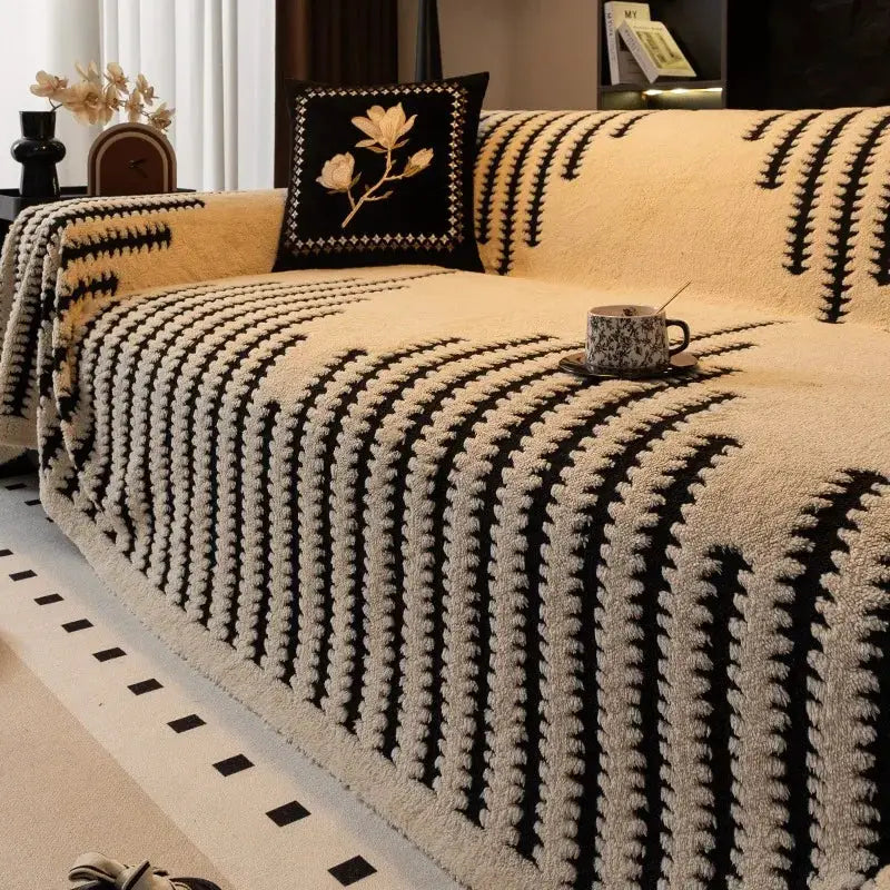 Simples Market large beige and black thickened warm jacquard fleece sofa blanket draped over a sofa.