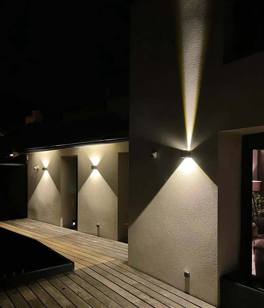 Simples Market MARPOU LED wall lamps; outdoor IP65 9W wall lights along exterior wall at night.