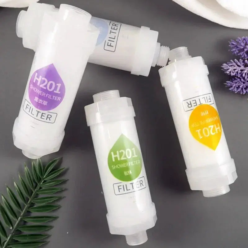 Shower filter cartridges by Simples Market, white cylinders with purple, green and orange labels, 4-pack
