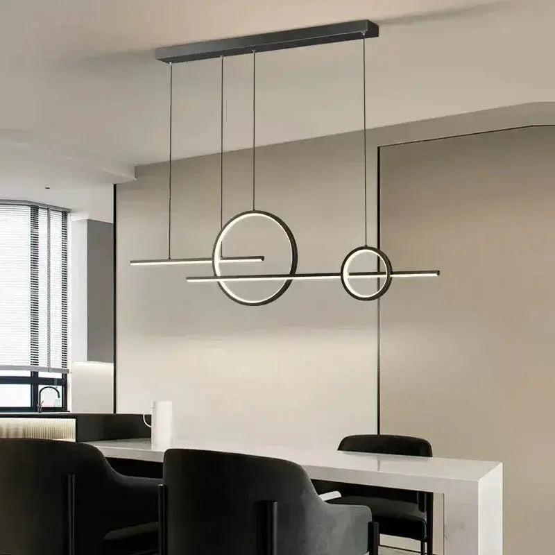 Modern LED chandelier pendant light by Simples Market with circular black metal rings and slim horizontal bar