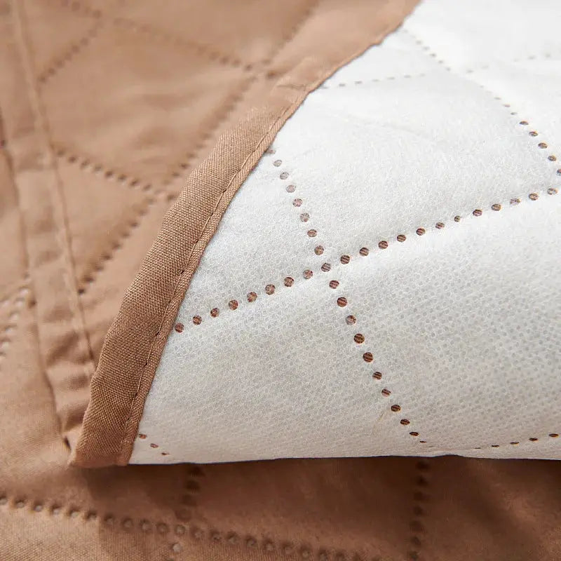 Recliner chair cover by Simples Market, tan quilted slipcover with brown border