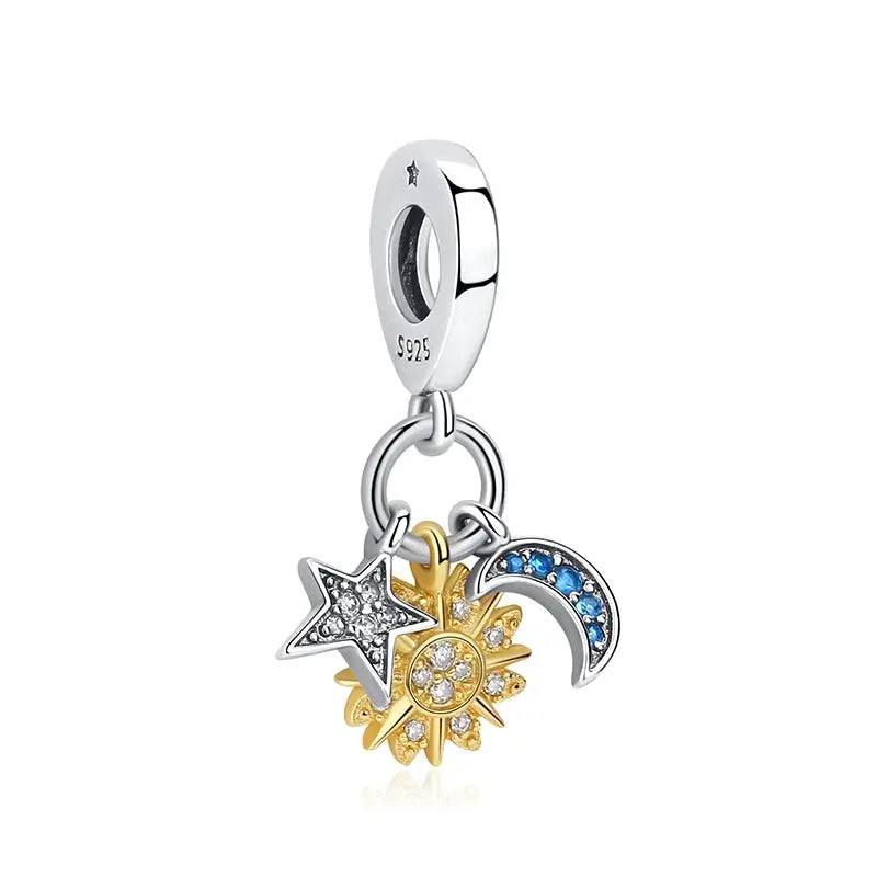 Sterling silver charm trio for bracelets featuring star, sun, and crescent moon with blue zircon crystals