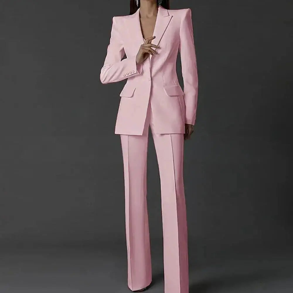 Pink women's two-piece pantsuit with long sleeves, single-button blazer and matching wide-leg pants by Simples Market