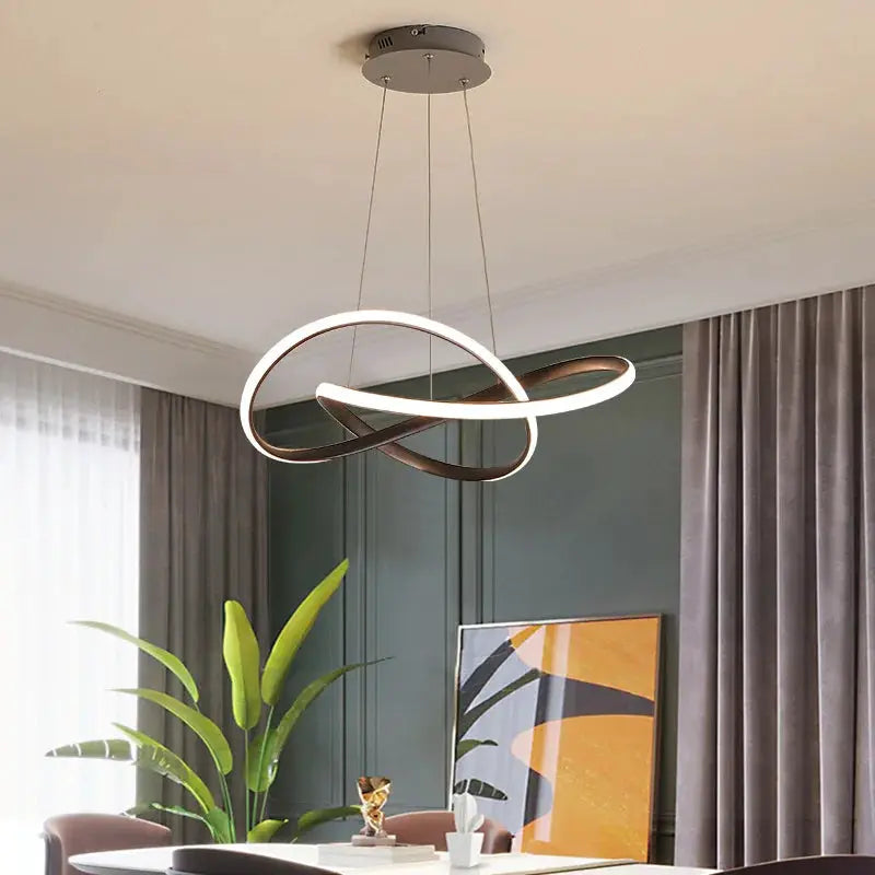 Dining room pendant lamp with interlocking circular rings in white and bronze, modern Nordic style.