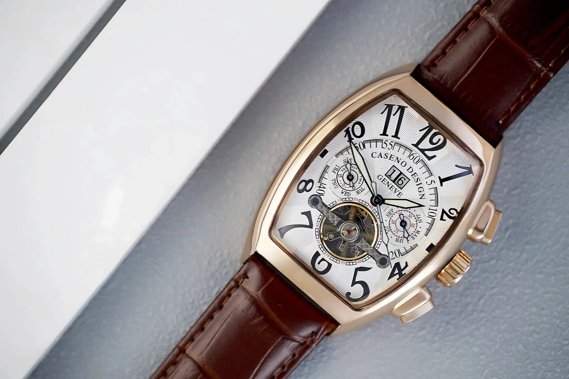 Caseno men's automatic tourbillon skeleton watch with calendar, night glow, brown leather strap, rose-gold tonneau case.
