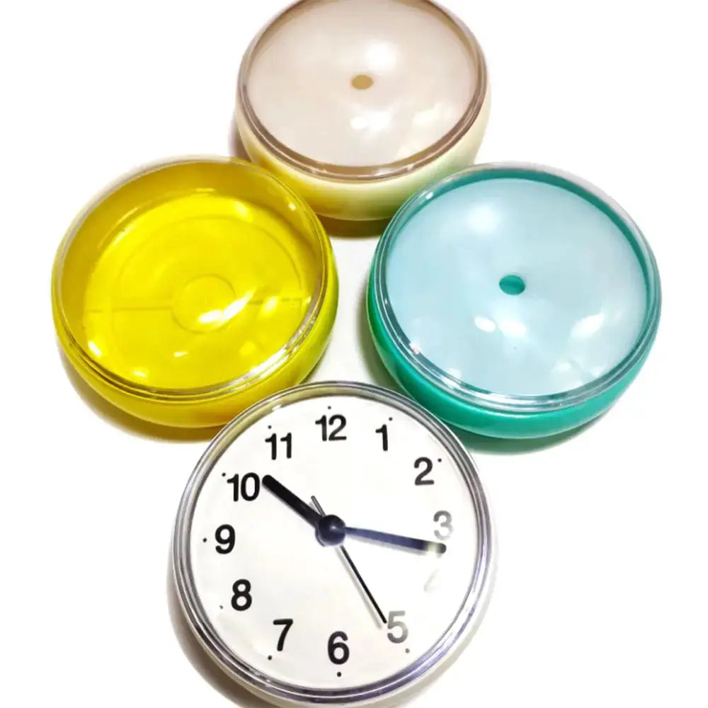 Mini suction wall clock with four colorful round cases; 7cm waterproof quartz timepiece