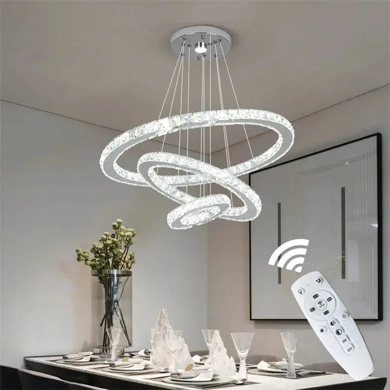 Modern crystal ring LED chandelier by Simples Market, chrome finish pendant ceiling lamp with remote control.