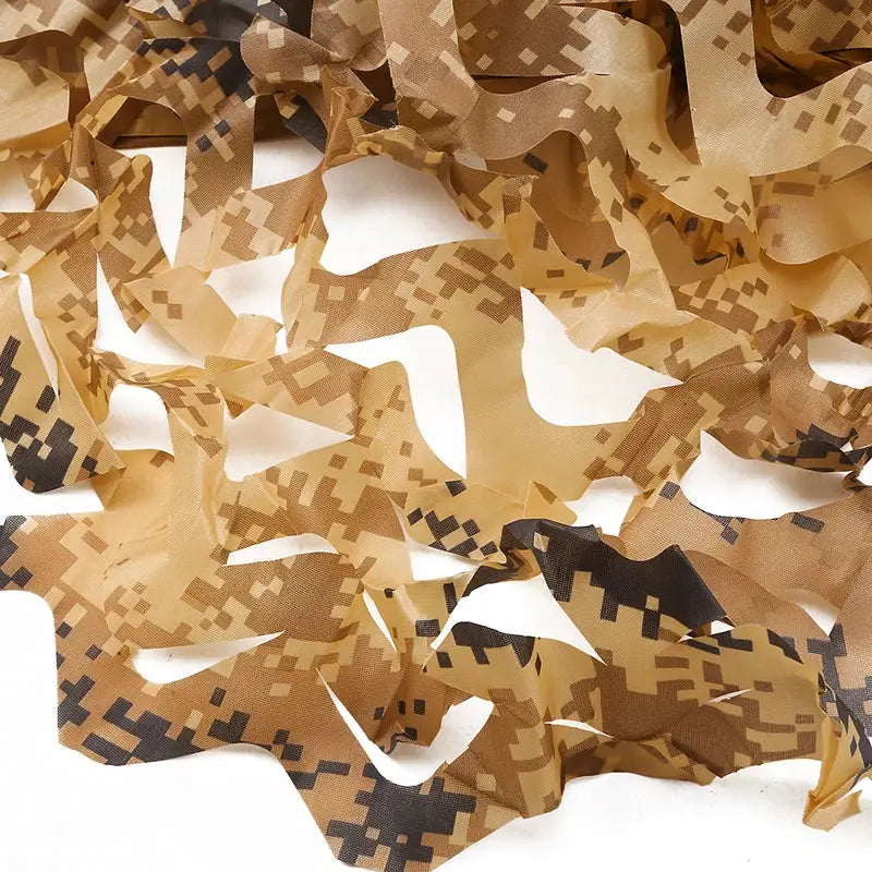 Simples Market desert camouflage netting in digital tan, brown and black pattern, shredded ribbons.