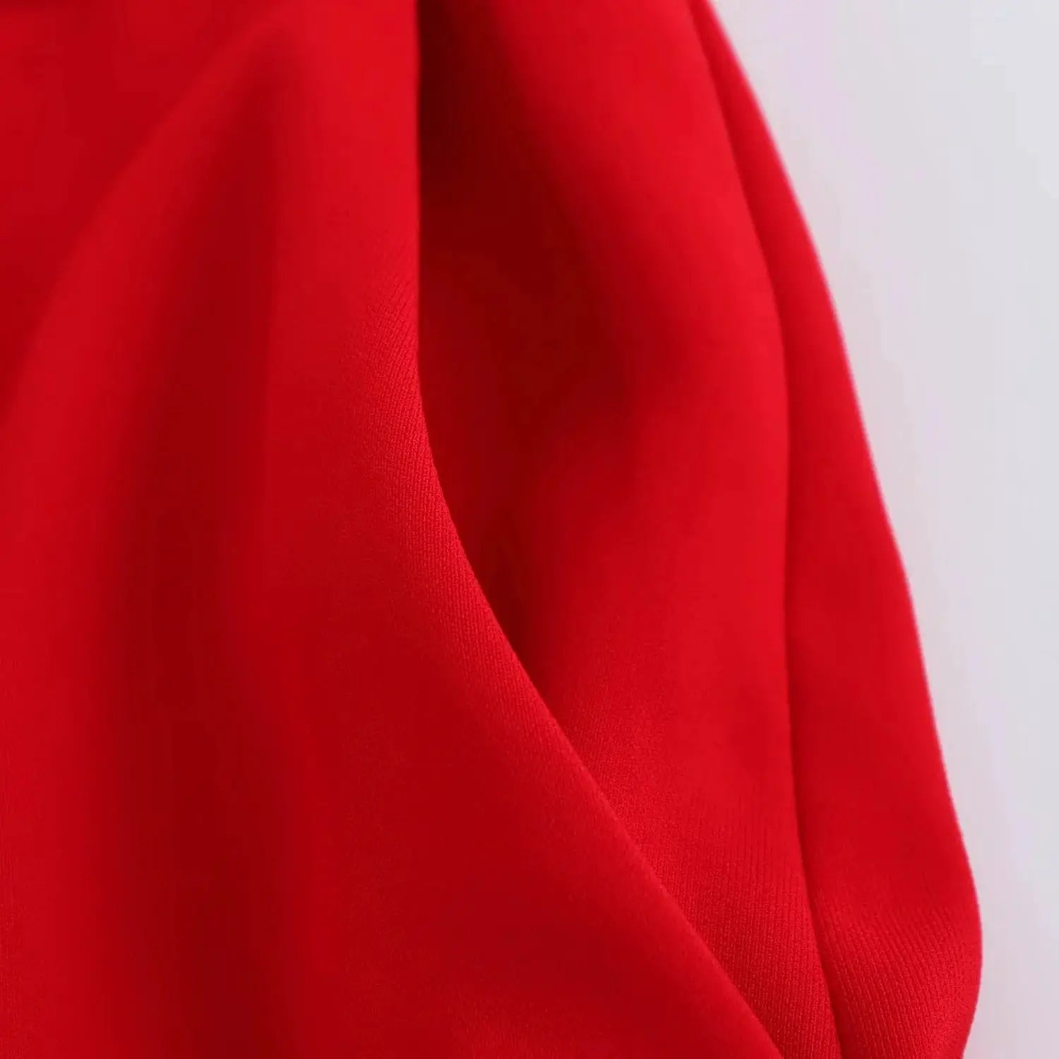 KONDALA red blazer fabric close-up, smooth woven material