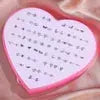 36-pair stud earrings set in resin with snowflake, cat, butterfly designs in a pink heart display box