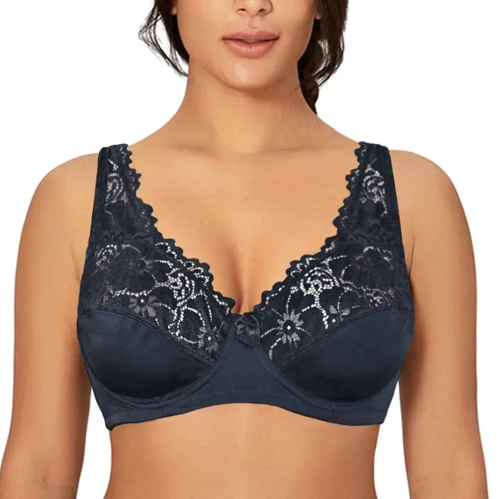 Lace underwire bra in navy by Simples Market with floral lace cups and center bow.