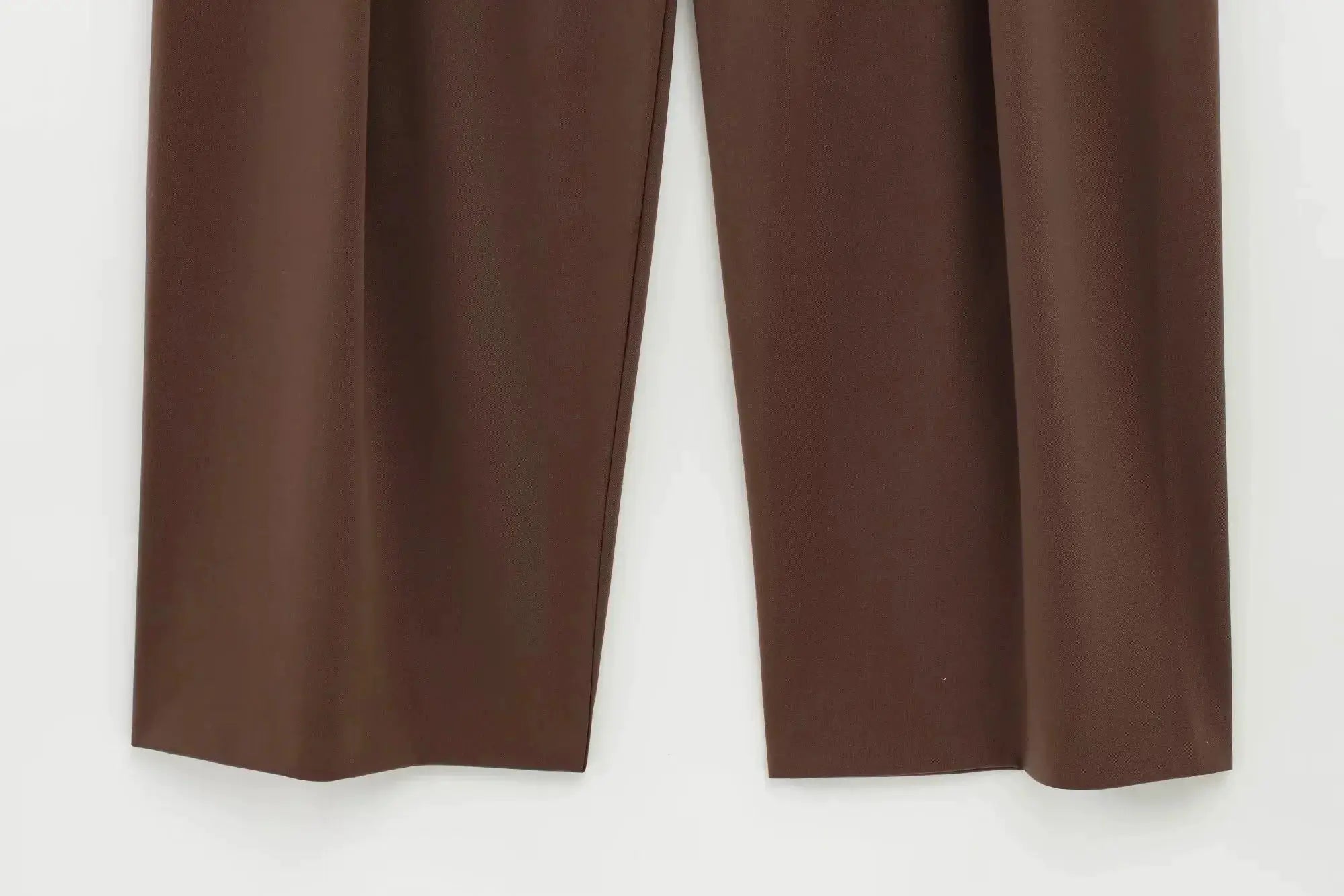 Brown women's suit pants, solid color with straight hems, part of a formal set