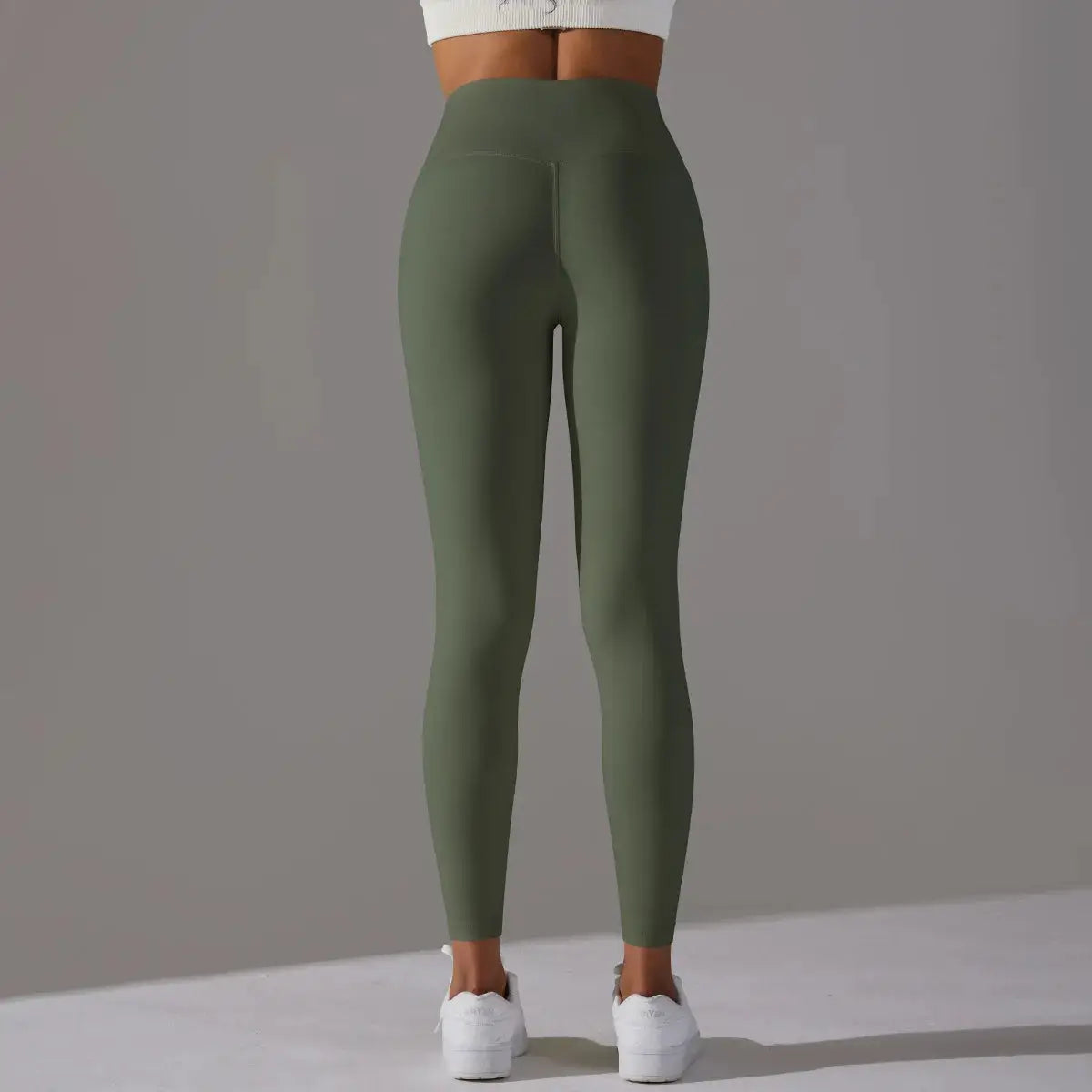 High-waist olive green women's leggings for fitness, yoga and running; tight fit.