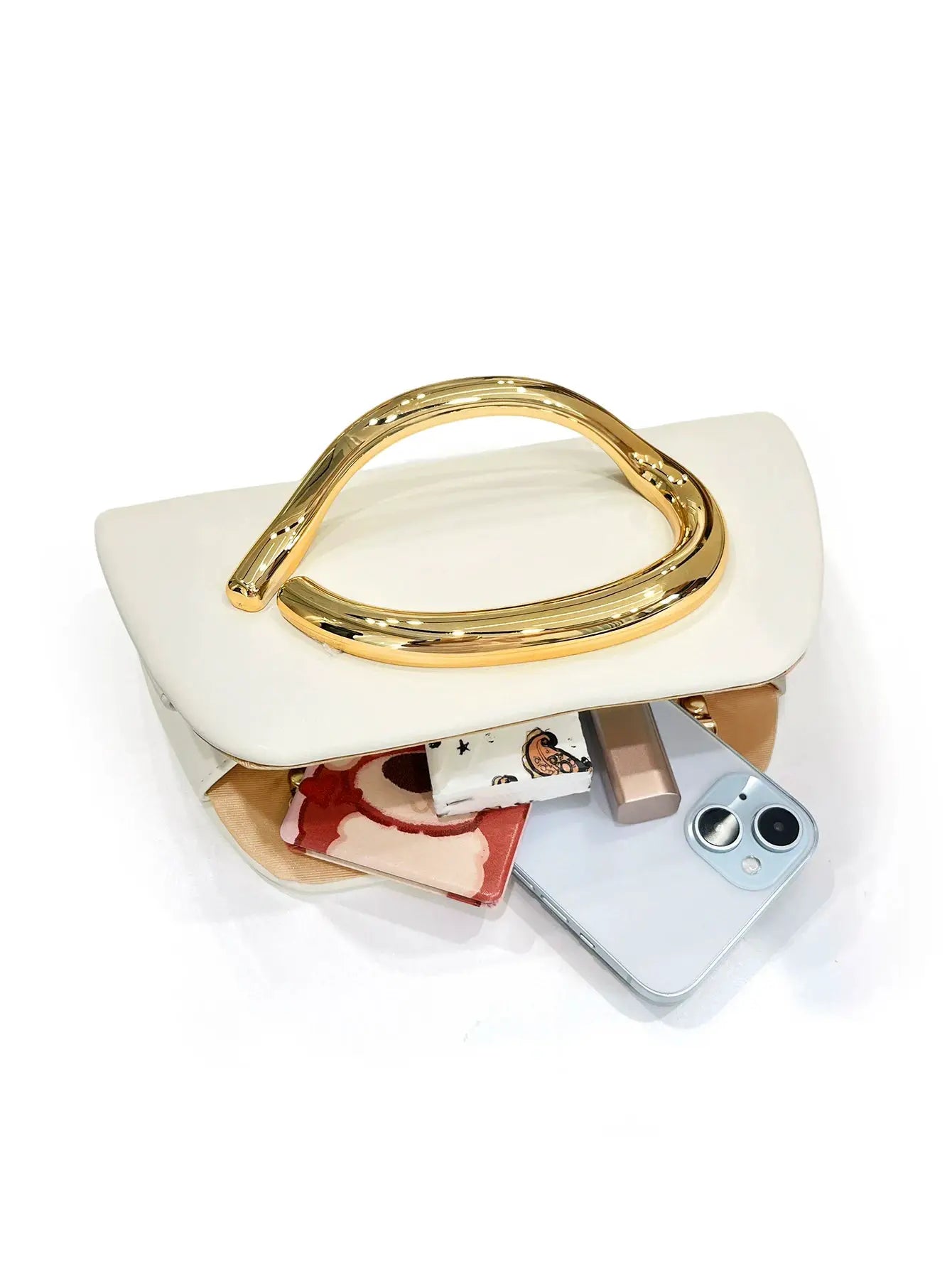 Box clutch in white with a gold-tone curved metal buckle handle by Simples Market, evening bag.