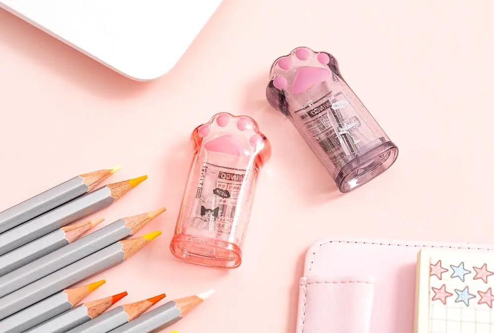 Kawaii cat paw-shaped pencil sharpeners (2) in pink and purple translucent plastic from Simples Market, stationery