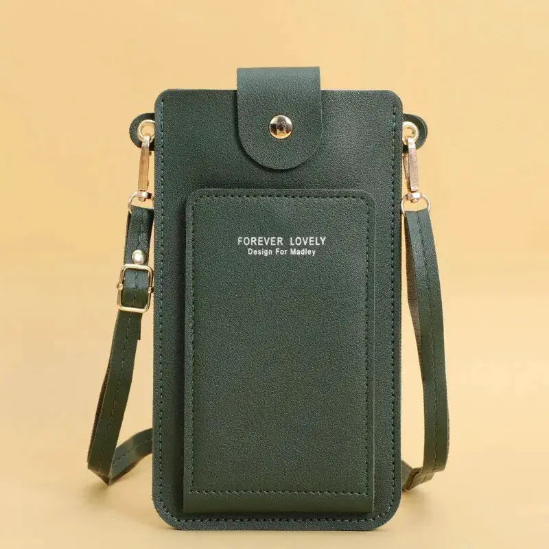 Crossbody bag in green faux leather by Forever Lovely with front pocket and gold hardware