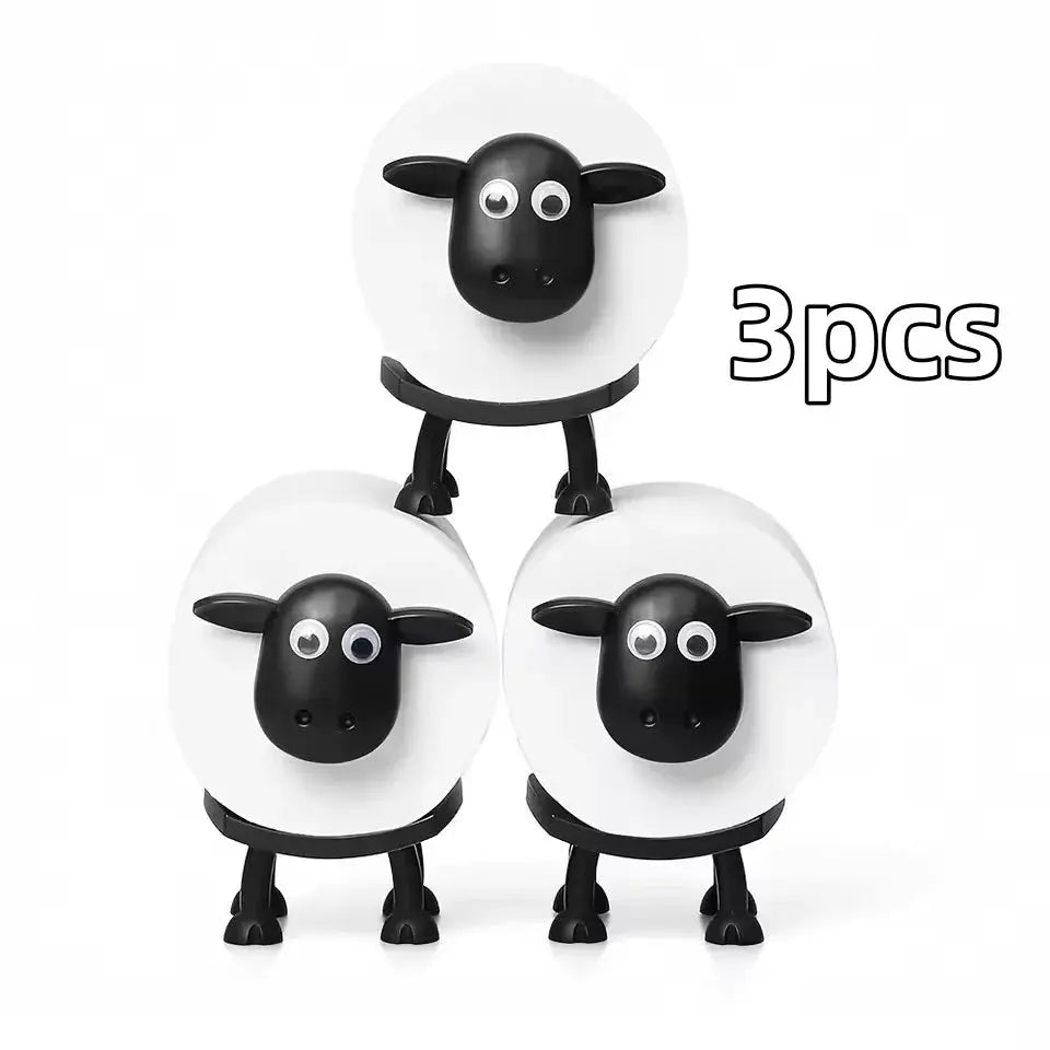 Sheep toilet paper holder set by Simples Market, white circular bases with black sheep heads, 3pcs