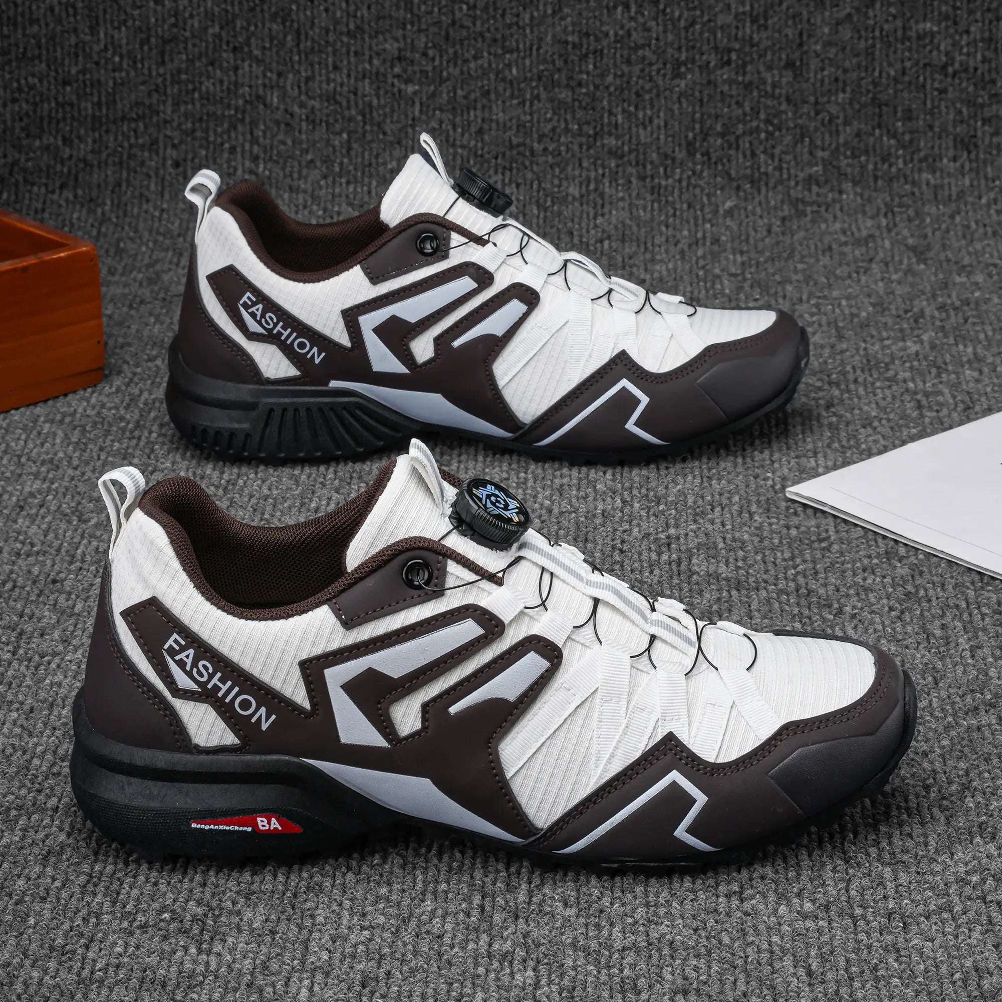 Pair of men's outdoor casual shoes, white with brown overlays and gray accents