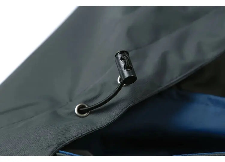 TRVLWEGO hiking jacket hood with black drawstring on waterproof fabric